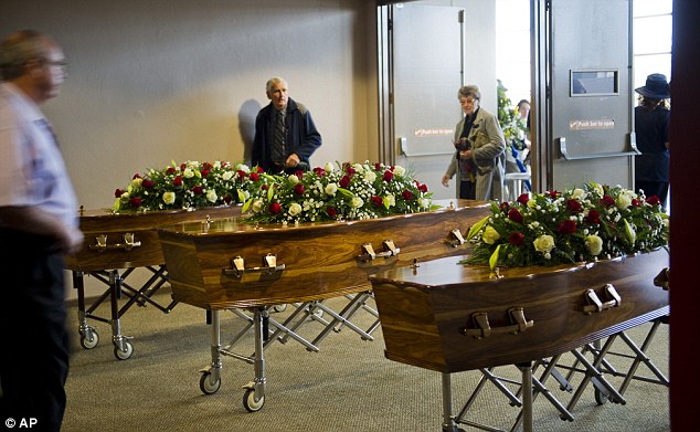 Coffins carrying the remains of Werner, Rode and Jean-Pierre Groenewald at a memorial service in Pretoria