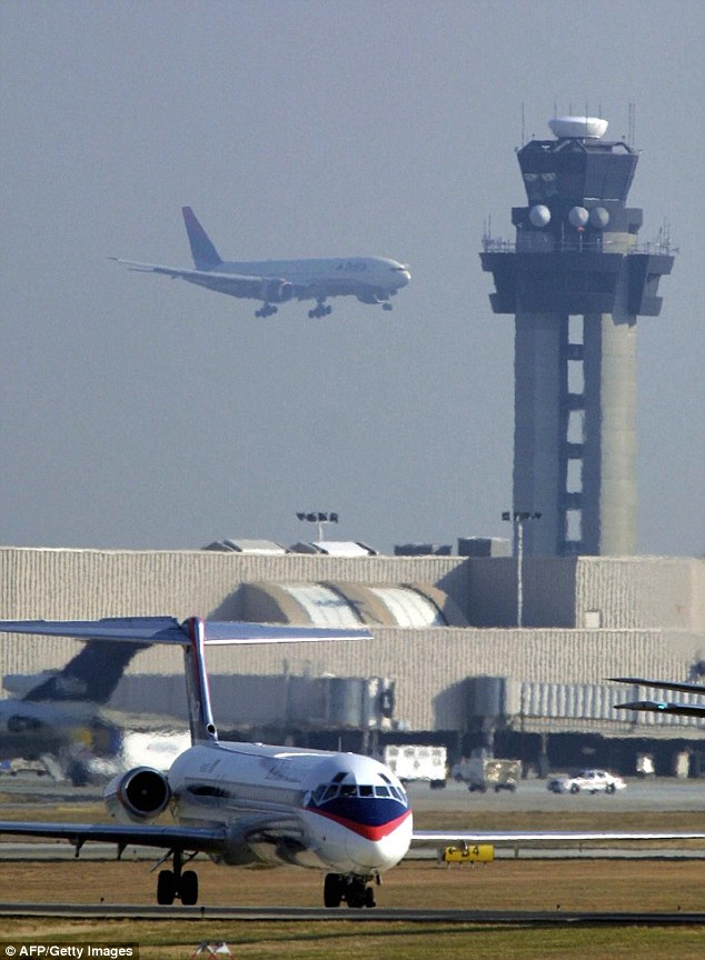 Investigators said Eugene Harvey was assigned to work in the baggage transfer room at Hartsfield-Jackson Atlanta International Airport, above, which is within a designated secure area