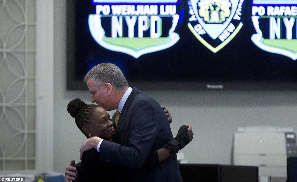 Embrace: De Blasio and his wife Chirlane McCray embraced publicly after the silence and urged others to do likewise