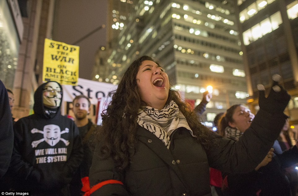 Some protesters chanted 'Hey-hey, ho-ho. These racist cops have got to go' and 'How do you spell racist? N-Y-P-D'