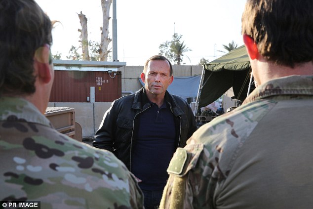 Wearing a leather jacket, Prime Minister Tony Abbott greeted diggers serving at the Baghdad Diplomatic Support Compound