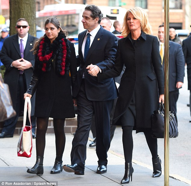 Son: Governor Andrew Cuomo, who is now Governor like his father before him, arrives at the wake with his girlfriend, Sandra Lee, right, and one of his daughters