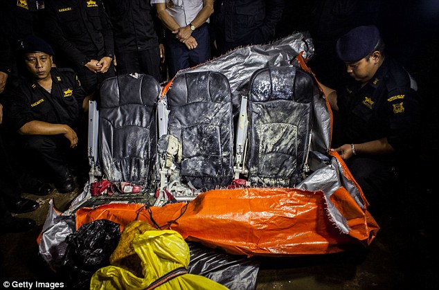 Indonesia Sea and Coast Guards display recovered seats from the AirAsia flight QZ8501 on Tuesday