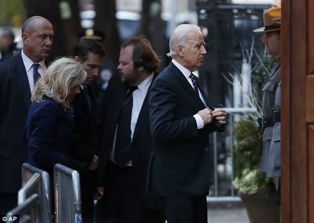 Somber: Biden was among a number of prominent Democrats who attended the event ahead of his funeral on Tuesday