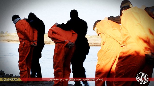Last march:The eight Iraqi police officers seen in the video were accused of infiltrating ISIS in order to spy in the organisation on the behalf of the Iraqi government