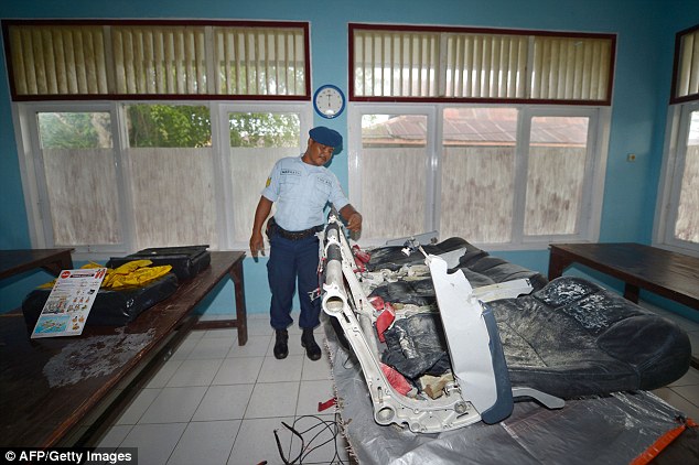 Newly recovered wreckage from AirAsia flight QZ8501 found during search operations in the Java sea is displayed in Pangkalan Bun on January 6