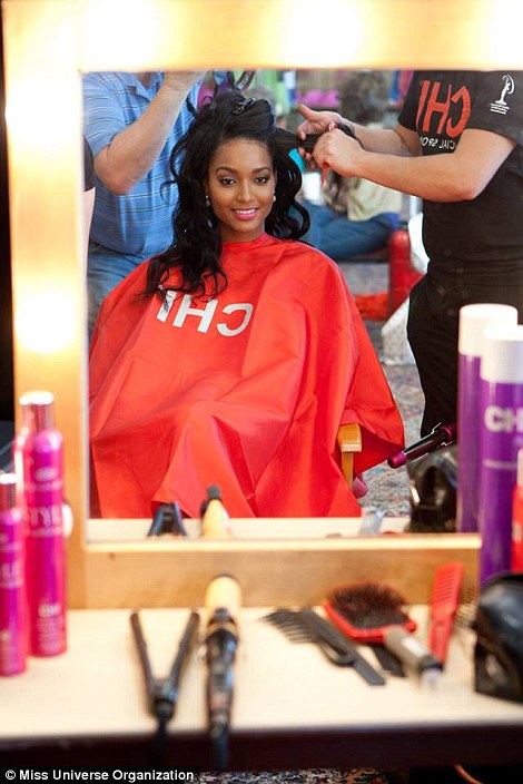 The contestants, including Miss Hungary 2014, Henrietta Kelemen, right, get primped and primed by the make-up artists backstage
