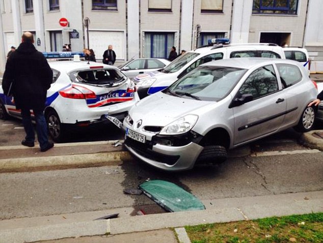 Officers were involved in a gunfight with the men, who escaped in a hijacked car and sped away from the 15th arrondissement office, towards east Paris 