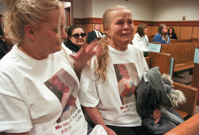 Ramirez's sister Julie (left) consoles her mother, Betty Ramirez, during court proceedings over the cop shoot
