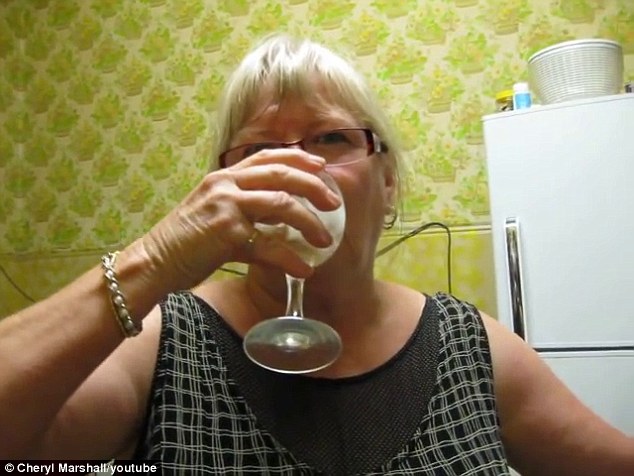 Bon appetit: Marshall starts sipping away her champagne that she made previously prior to the video