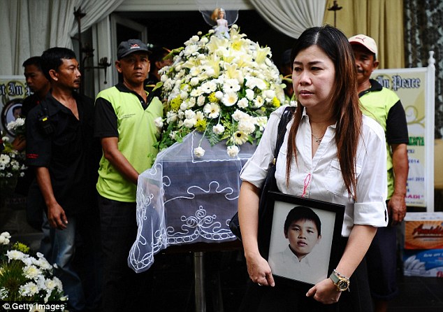 Family members held funerals for victims of the crash on Thursday