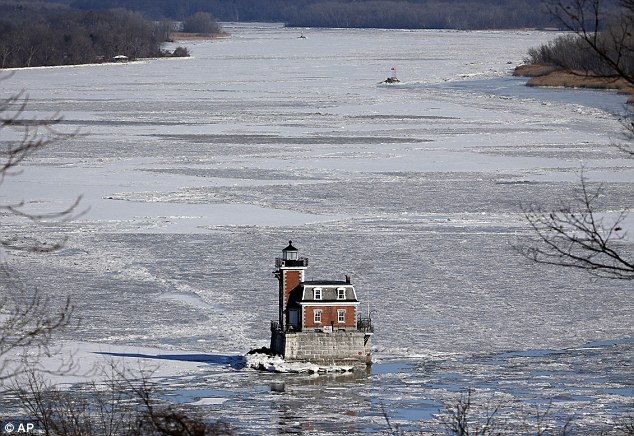 The Hudson-Athens Lighthouse is surrounded by the icy waters of the Hudson River on Thursday, January 8, 2015, in Hudson, New York
