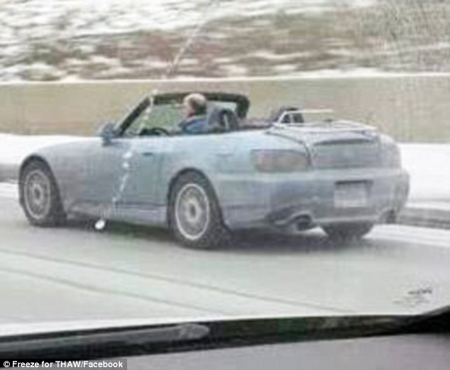 Paying it foward: De Jong has started advertising a non-profit called THAW on the side of his car. The charity helps Michigan families in need pay their utility bills 