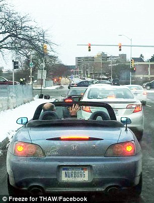 Morning rush: Detroit residents often take pictures of de Jong out and about in unusual weather. His commute to his IT job in downtown Detroit takes about 50 minutes each way