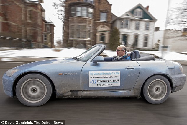 Brrr: Laurens de Jong has been riding his convertible with the top down for the past 12 years 