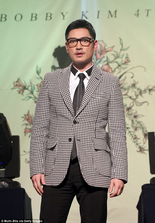 Commotion: Korean pop-star Bobby Kim allegedly got drunk and had to be escorted off a Korea Air flight to San Francisco and is now under investigation for sexually harassing a flight attendant 