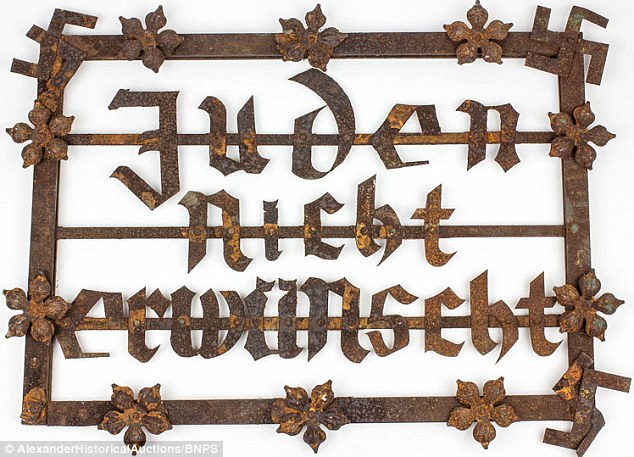 This street sign, which reads 'Jews not allowed,' is due to go under the hammer with more than 75-Holocaust related items at Alexander Historical Auctions in Maryland. A buyer is expected to have to pay around $6,000 for the sign