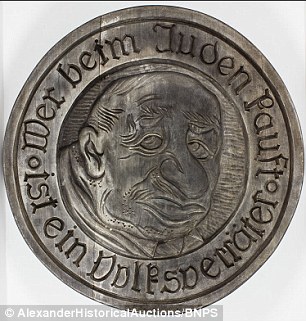 This token, expected to fetch $2,000, has the inscription 'He who buys from Jews is a national traitor'