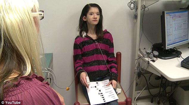 Born death: Maggie Gleason was filmed as doctors at UH Case Medical Center in Cleveland turned on an auditory brainstem implant (ABI), placed on the lower part of her brain during a ten hour surgery