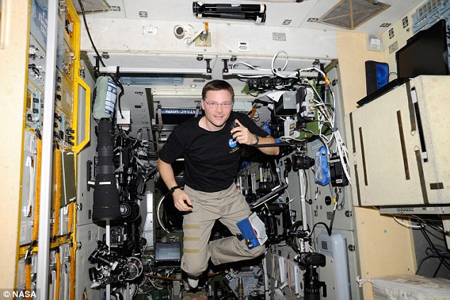 Nasa astronaut Doug Wheelock, Expedition 24 flight engineer, is pictured using a ham radio system in the Zvezda Service Module of the International Space Station on 5 September 2010