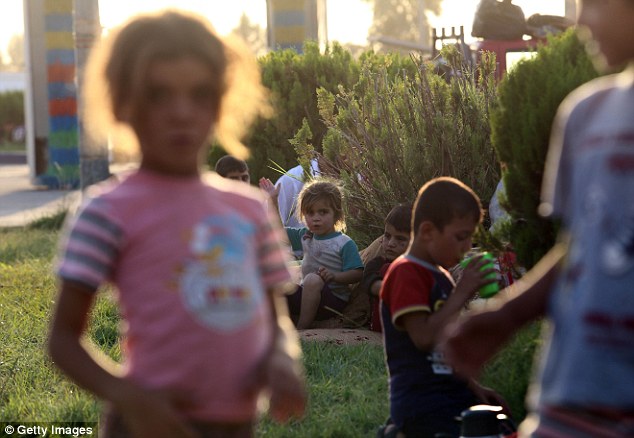 The U.N. Committee on the Rights of the Child - which produced the report into the children's fates - is calling on the Iraqi government to help rescue those captured by the Islamic militants. Pictured: Yazidi children after they fled from ISIS
