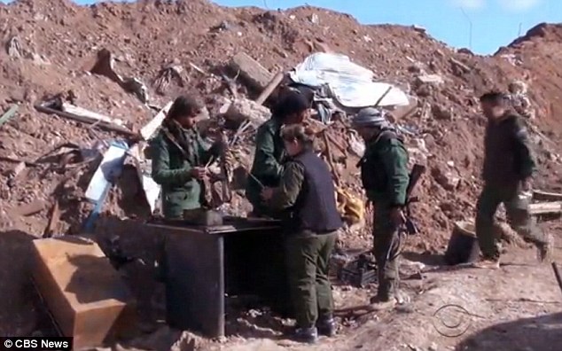 Motley crew: The rebel group Ms Sipan is part of is made up of volunteers from the local towns and villages, comprising housewives, teachers, farmers and shopkeepers