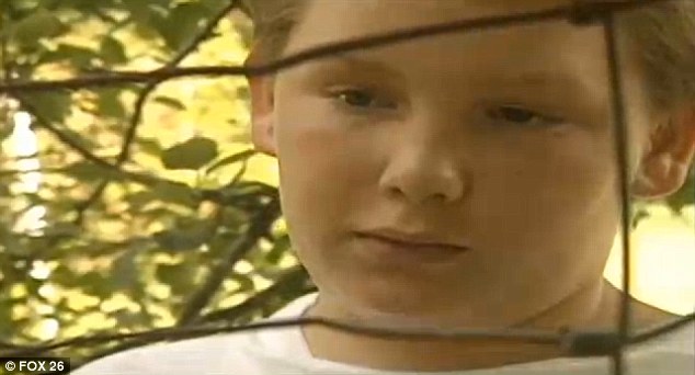 It was determined last year that Collins, now 29, could be tried as an adult in the trial even though he was 13, pictured above, at the time of the alleged attack