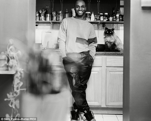 Feline fine: Mark, a furniture designer and builder, still cares for and loves a gift given to him by his first boyfriend - a cat named Amiga