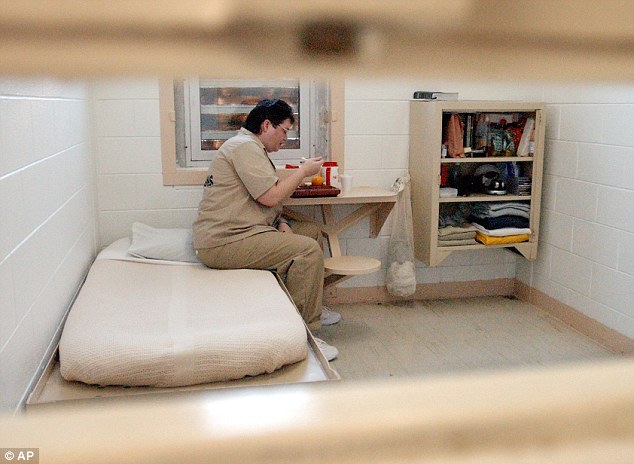 Locked up: Gissendaner, who will be the first woman to be executed in Georgia in 70 years, is seen eating a meal in her cell at Metro State Prison in Atlanta in 2004. She has requested a 2,400-calorie final meal