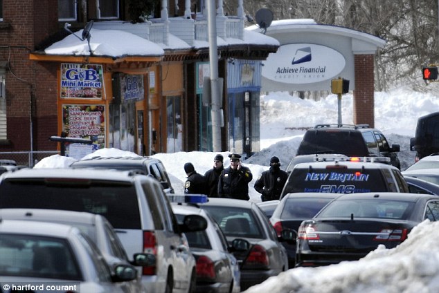 The manager of Achieve Financial Credit Union (pictured) and his mother were strapped to supposed explosive devices after two masked suspects broke into their Bristol, Connecticut home Monday morning