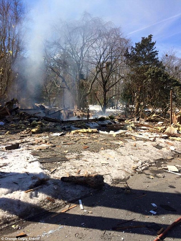 All that's left: The above scene shows where a house used to stand before the explosion which virtually disintegrated the structure